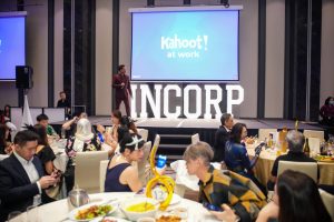 corporate event doing a kahoot! quiz with marquee sign and LED screen