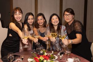 Group of people smiling at a corporate event